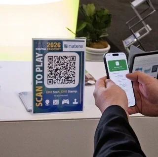 A delegate scanning a booth QR code with their phone